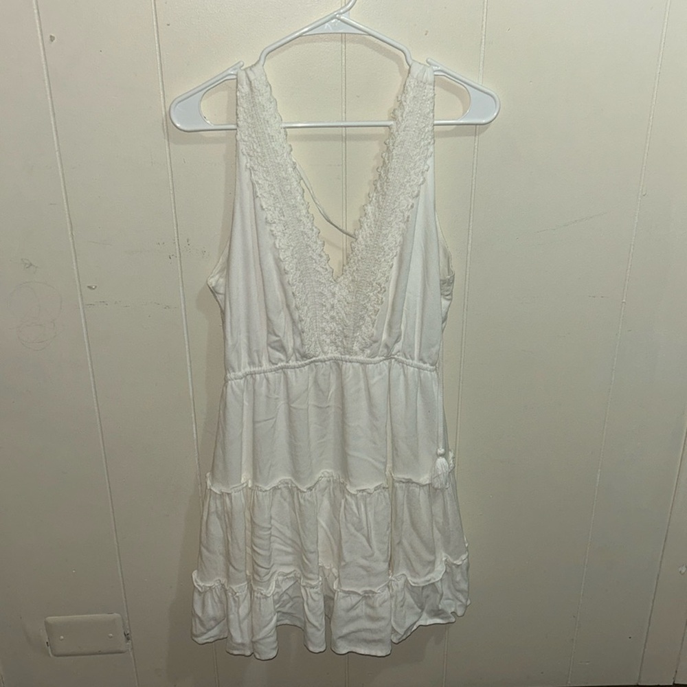 White v neck dress super comfy it’s a mini dress it’s a tie back, crochet